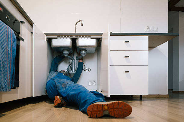 Professional Emergency Plumber technician working in Osage, IA